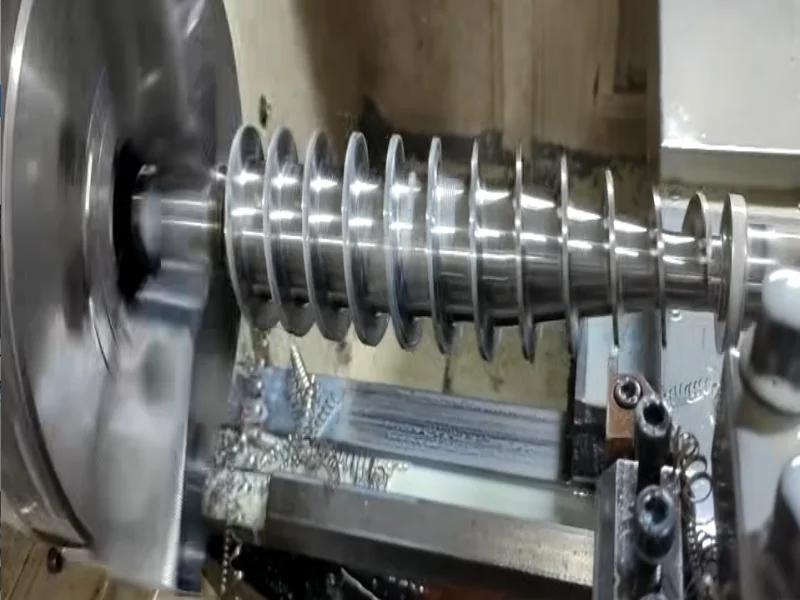 CNC machining in action with coolant spray